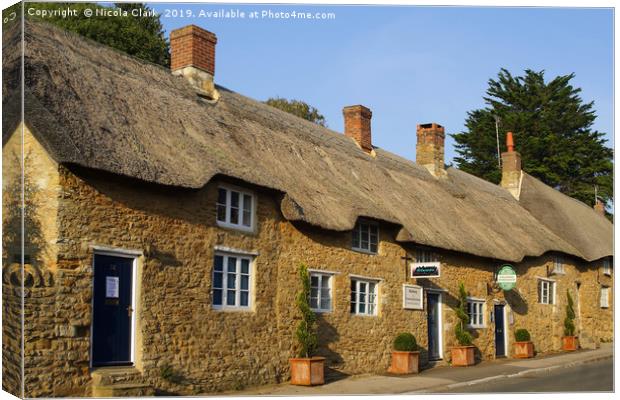 Thatched Cottages Canvas Print by Nicola Clark