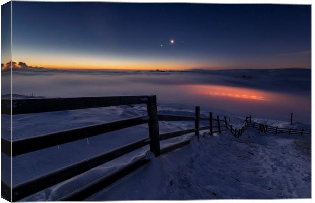 Winter conjunction over freezing fog and snow Canvas Print by John Finney