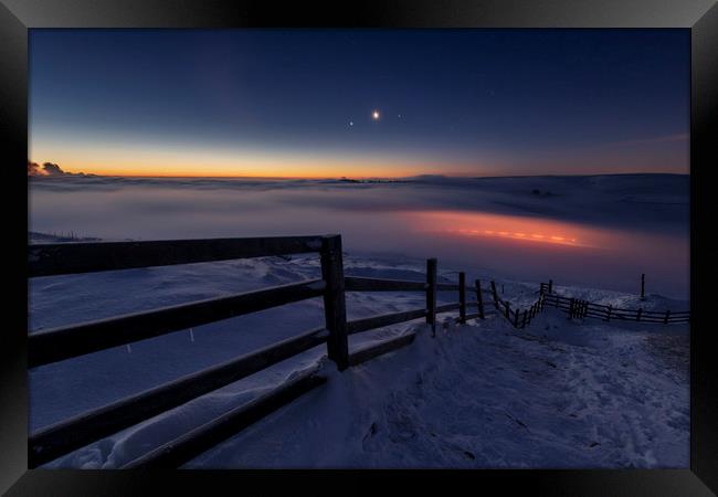 Winter conjunction over freezing fog and snow Framed Print by John Finney