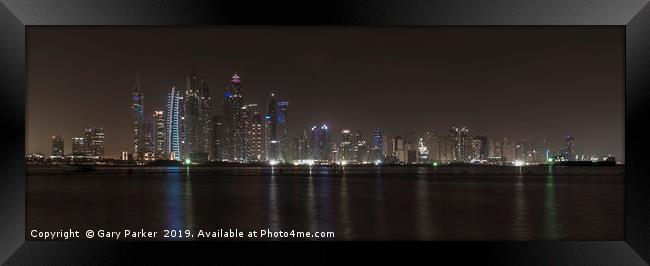 Skyscrapers of Dubai Marina at night.  Framed Print by Gary Parker