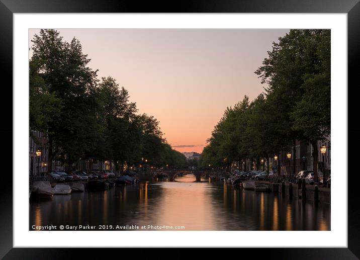 Sunset, looking down a canal in Amsterdam. Framed Mounted Print by Gary Parker
