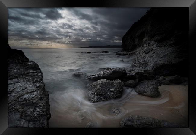 Rugged Cornwall coastline at dusk Framed Print by Eddie John