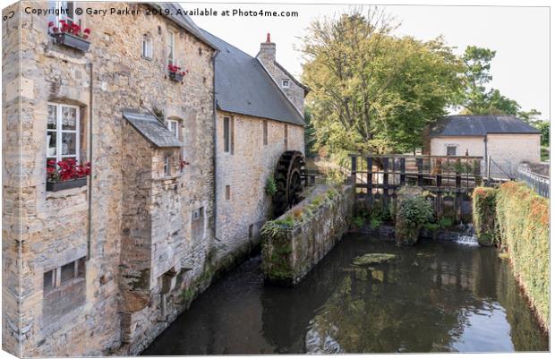 A watermill and a lock in Bayeux (France). Canvas Print by Gary Parker