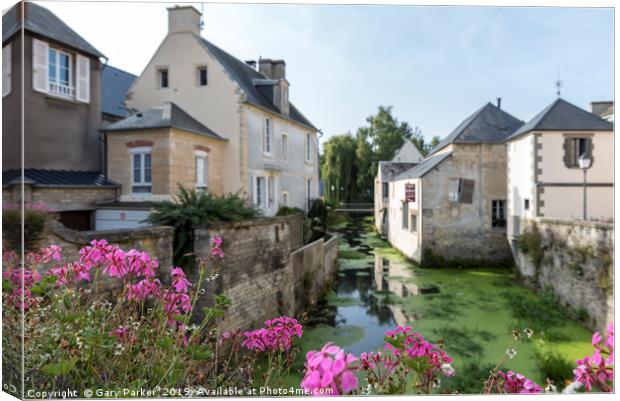 The River Aure in Bayeux, France Canvas Print by Gary Parker