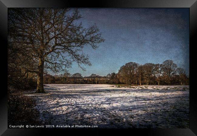 Snowy Tidmarsh Meadows Framed Print by Ian Lewis