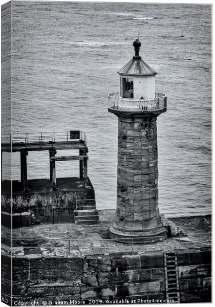 Whitby pier lighthouse Canvas Print by Graham Moore