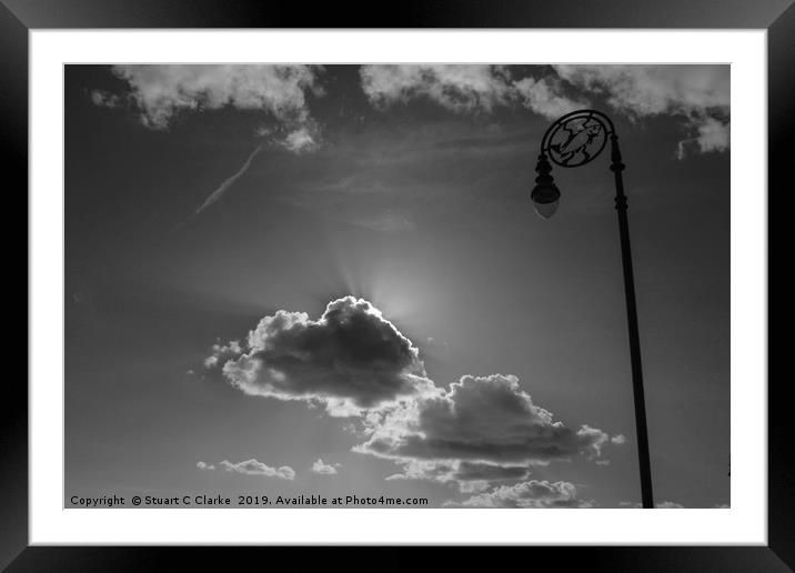 Breaking through the clouds Framed Mounted Print by Stuart C Clarke