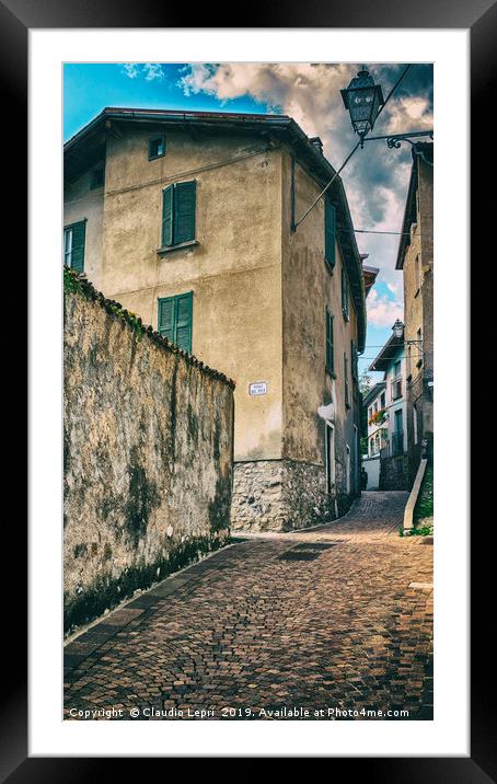 Crossing of alleys in alpine village Framed Mounted Print by Claudio Lepri