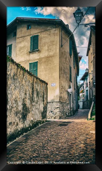 Crossing of alleys in alpine village Framed Print by Claudio Lepri