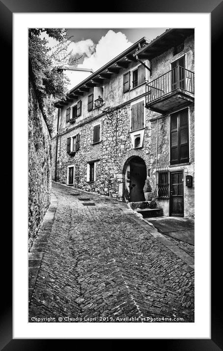 Alley in alpine village, BW Framed Mounted Print by Claudio Lepri