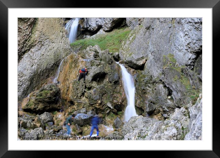Climbers making their way up the cliffs of Gordale Framed Mounted Print by Louise Heusinkveld