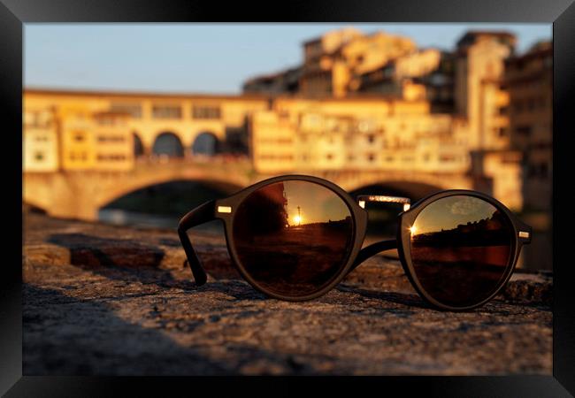 The sun sets over Ponte Vecchio in Florence, Italy Framed Print by Lensw0rld 