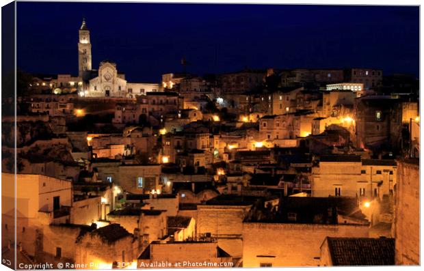 View over the gorgeous city of Matera at night Canvas Print by Lensw0rld 