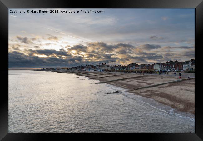 Felixstowe seafront with golden sun behind clouds  Framed Print by Mark Roper
