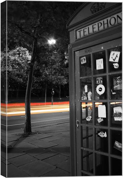 London Telephone box with trail of lights Canvas Print by Sarah Waddams