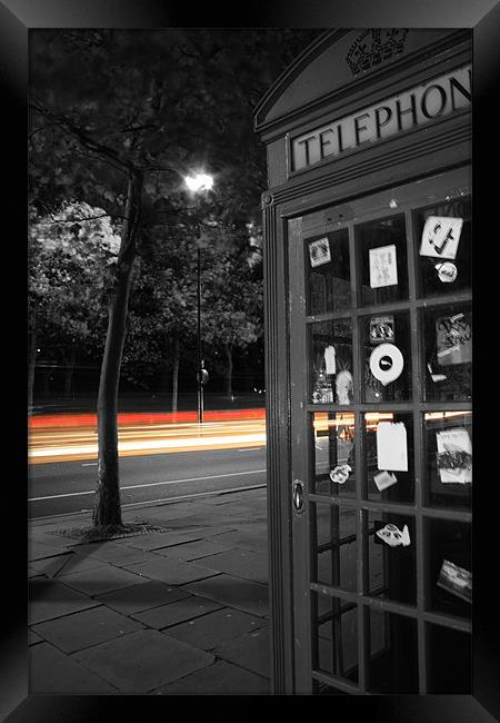 London Telephone box with trail of lights Framed Print by Sarah Waddams
