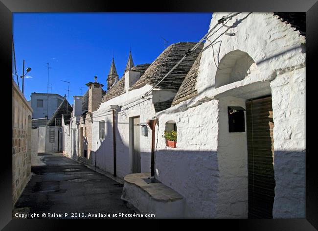 Street in Alberobello with the famous "Trulli" Framed Print by Lensw0rld 