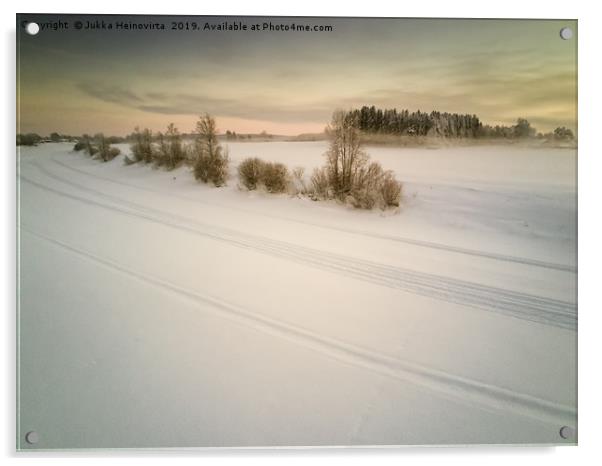 Snow Mobile Tracks On An Icy River Acrylic by Jukka Heinovirta
