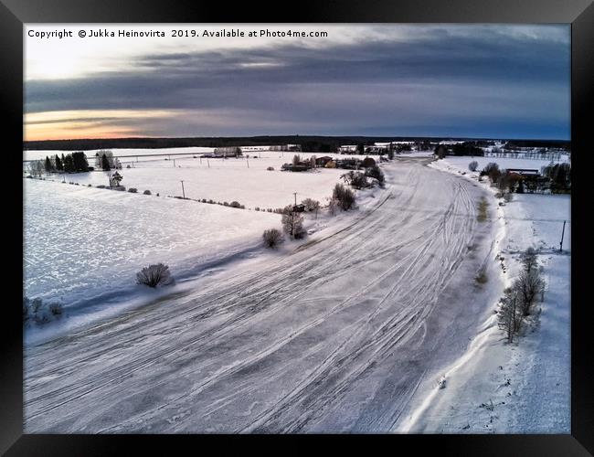 Aerial View Of The Icy River Framed Print by Jukka Heinovirta