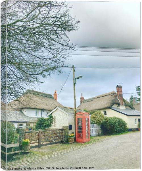 Phone box and cottages Canvas Print by Alexia Miles