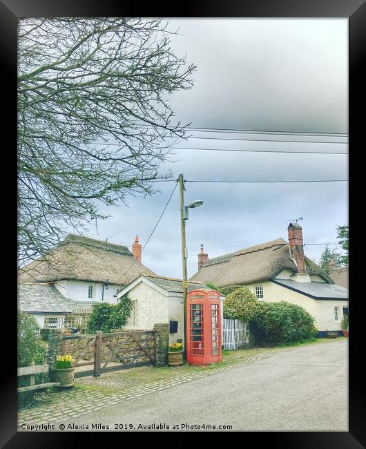 Phone box and cottages Framed Print by Alexia Miles
