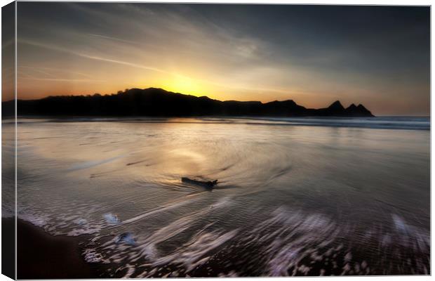 Outgoing sea at Three Cliffs bay Canvas Print by Leighton Collins