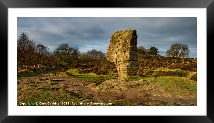 The Cork Stone on Stanton Moor. Framed Mounted Print by Chris Drabble