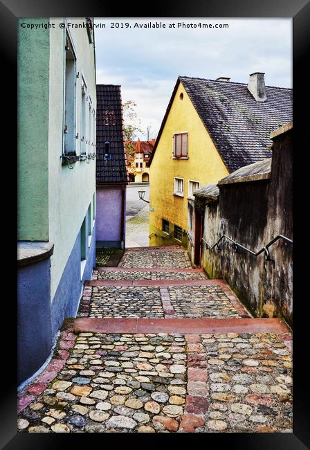 A quiet rising path between properties in Breisach Framed Print by Frank Irwin