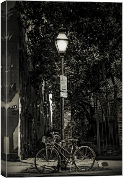 Bicycle Chained to Black Lamp Post Canvas Print by Darryl Brooks