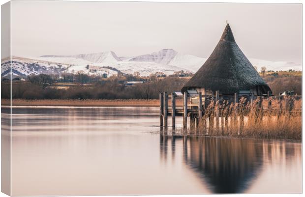 A Recreation of an Iron Age Hut, Lakeside Canvas Print by Dean Merry