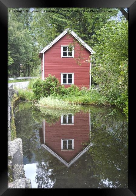 Reflection of a little red house Framed Print by Sylvain Beauregard