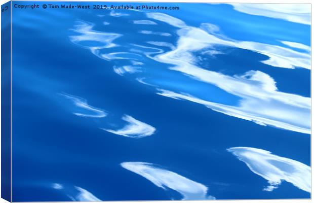 Clouds reflected in glassy waves Canvas Print by Tom Wade-West