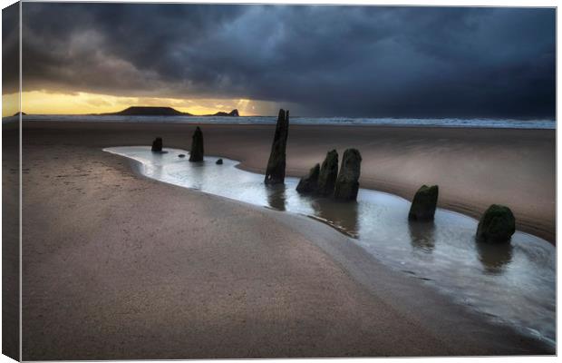 Dramatic sunset at Worms Head and Rhossili Bay Canvas Print by Leighton Collins