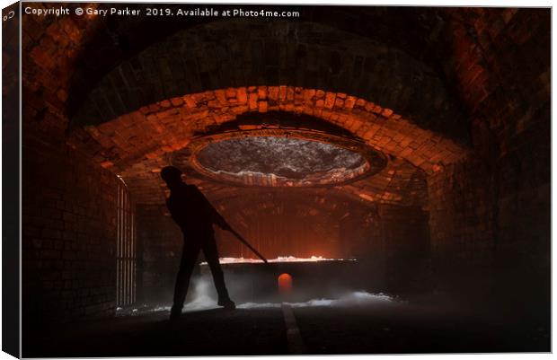 silhouette of iron worker stoking a furnace Canvas Print by Gary Parker