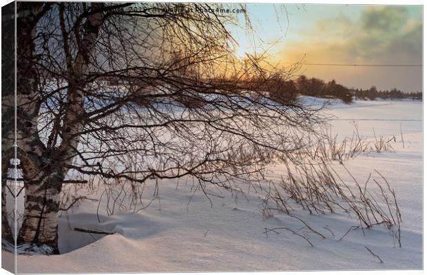 Dramatic Sunset Over The Icy River Canvas Print by Jukka Heinovirta