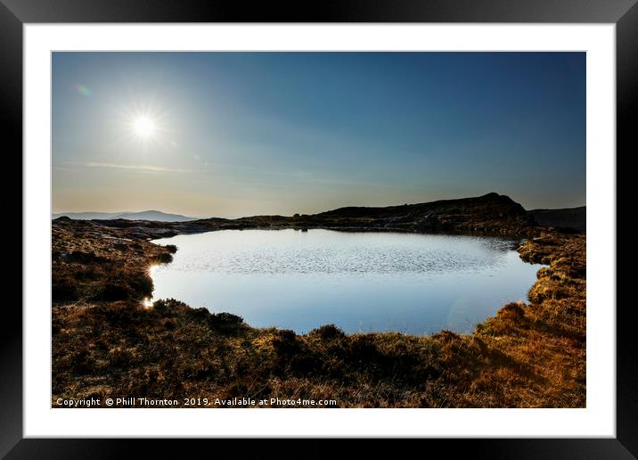 Sunset over Loch na Clarlaich to the Isle of Skye. Framed Mounted Print by Phill Thornton