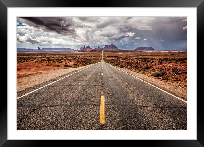 The long straight road to Monument Valley, Utah Framed Mounted Print by Steven Clements LNPS