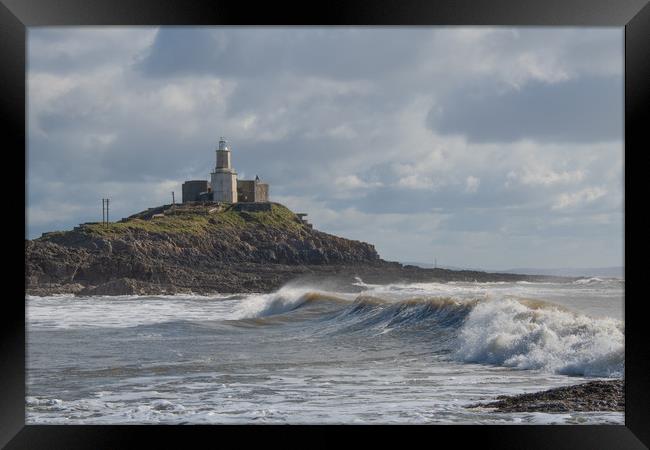 Mumbles lighthouse with wave. Framed Print by Bryn Morgan