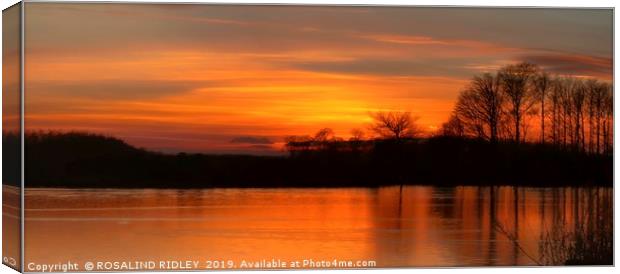 Sunset reflections across the lake Canvas Print by ROS RIDLEY