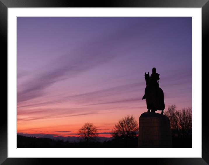 Robert the Bruce statue at sunset. Framed Mounted Print by Tommy Dickson