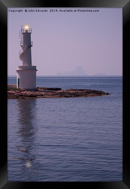 La Savina Lighthouse and Es Vedra Framed Print by John Edwards