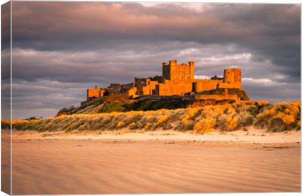 Bamburgh Castle in the sunset  Canvas Print by Naylor's Photography
