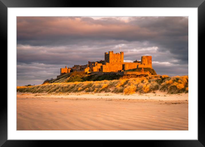 Bamburgh Castle in the sunset  Framed Mounted Print by Naylor's Photography