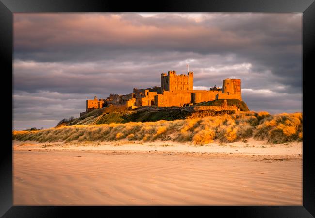 Bamburgh Castle in the sunset  Framed Print by Naylor's Photography