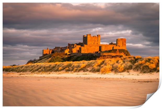 Bamburgh Castle in the sunset  Print by Naylor's Photography