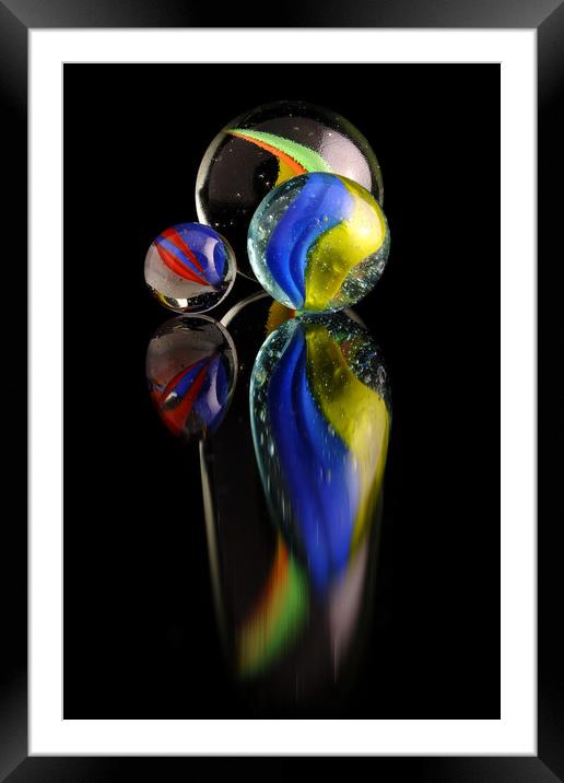 Three colourfull marbles reflecting Framed Mounted Print by Tony Claes