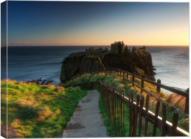 Sunrise at Dunnottar Castle. Canvas Print by Tommy Dickson