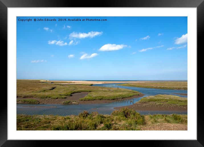 Thornham Creek and the sea Framed Mounted Print by John Edwards