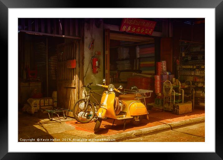 Yellow scooter Framed Mounted Print by Kevin Hellon