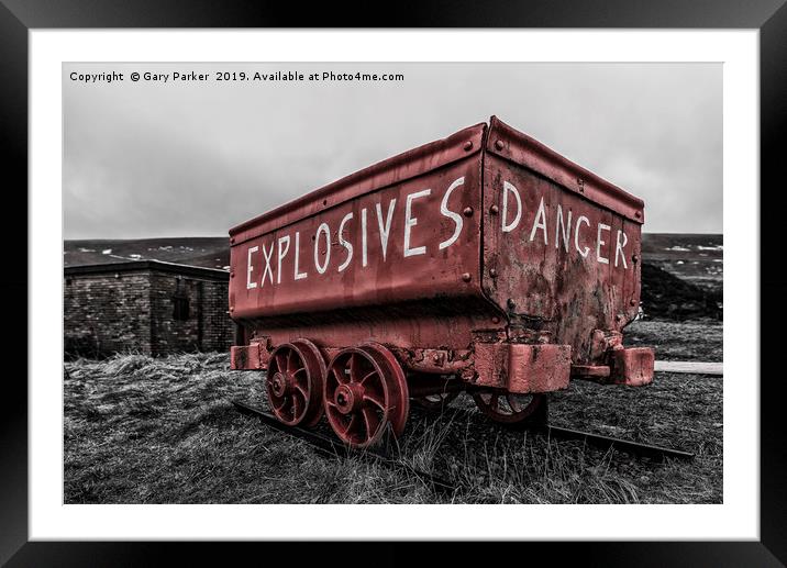 A bright red, weathered, mine cart Framed Mounted Print by Gary Parker